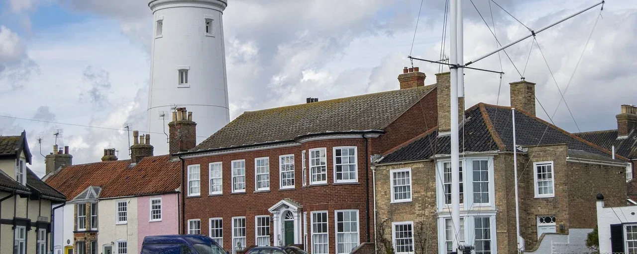 Brick houses beneath the lighthouse in Southwold