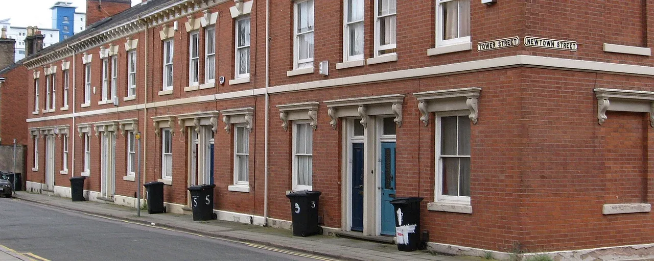 Red-brick terraced houses on a quiet street in Leicester Red-brick terraced houses on a quiet street in Leicester