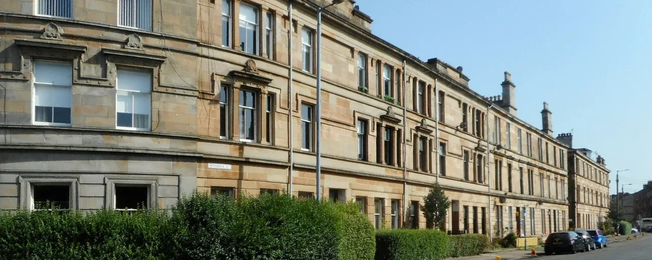 Sandstone tenement flats and hedges along Nithsdale Street Sandstone tenement flats and hedges along Nithsdale Street